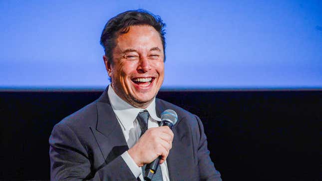 A photo of Elon Musk laughing while holding a microphone is shown.