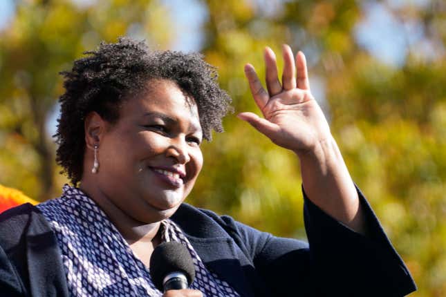 In this Monday, Nov. 2, 2020, file photo, Stacey Abrams speaks to Biden supporters as they wait for former President Barack Obama to arrive and speak at a campaign rally for Biden at Turner Field in Atlanta. 