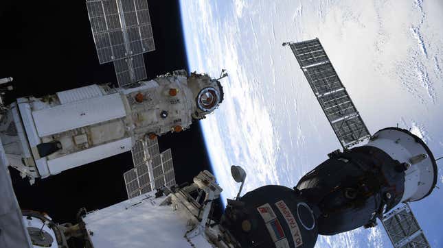 The Nauka module (left) docked to the ISS, with a Soyuz spacecraft (right) parked nearby. 