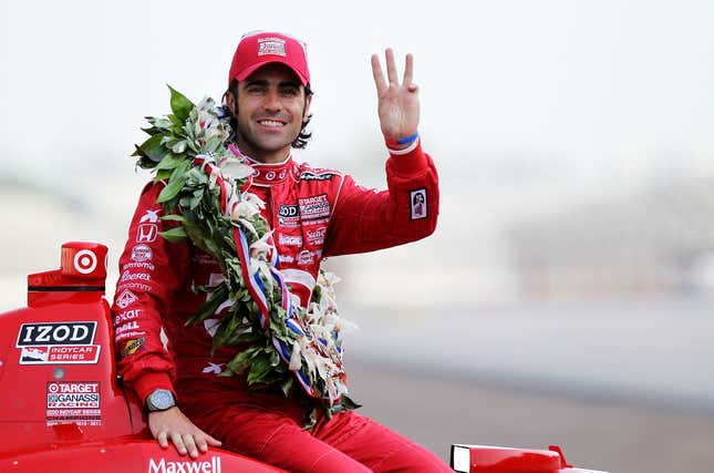 Dario Franchitti poses with a wreath after winning the 2012 Indy 500, his third victory