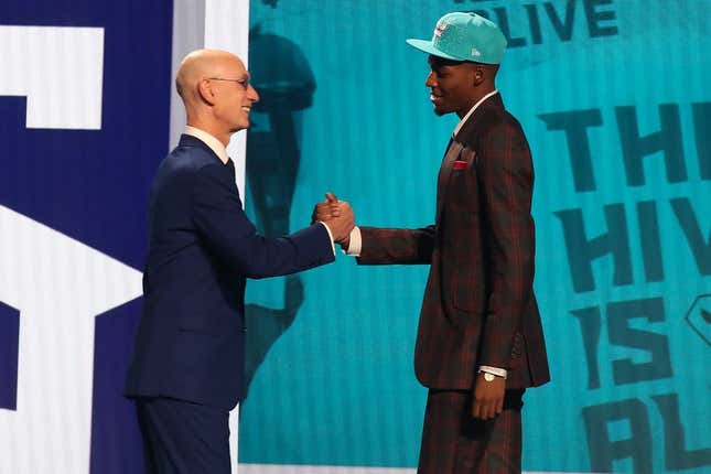 Jun 22, 2023; Brooklyn, NY, USA; Brandon Miller (Alabama) is greeted by NBA commissioner Adam Silver after being selected second by the Charlotte Hornets in the first round of the 2023 NBA Draft at Barclays Arena.