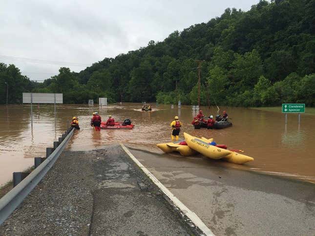 Emergency crews take out boats on a flooded highway in West Virginia in June 2016. (West Virginia Department of Transportation/Handout)