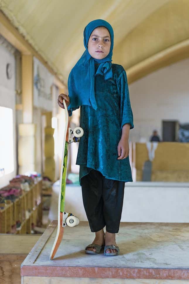 Image for article titled Photos: Forbidden from riding bikes, fearless Afghan girls are skateboarding around Kabul