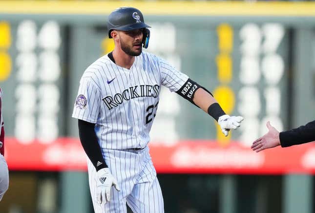 Apr 28, 2023; Denver, Colorado, USA; Colorado Rockies right fielder Kris Bryant (23) reacts following his single in the first inning the Arizona Diamondbacks at Coors Field.