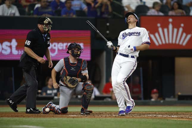 Jun 26, 2023; Arlington, Texas, USA; Texas Rangers shortstop Corey Seager (5) reacts after being hit by a pitch in the fifth inning against the Detroit Tigers at Globe Life Field.