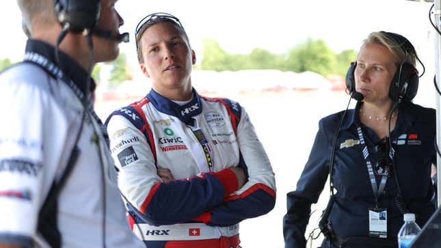 Ed Carpenter (left) speaks with Simona de Silvestro (center) and Beth Paretta (right) at the 2022 Honda Indy 200.