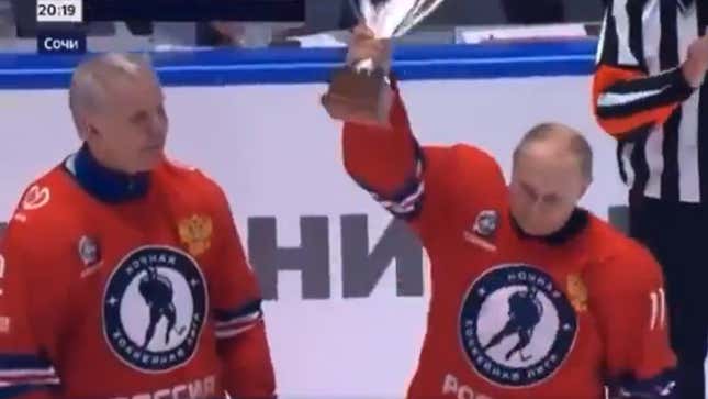 Vladimir Putin (r.), president of the Russian Federation and hockey GOAT (not really)