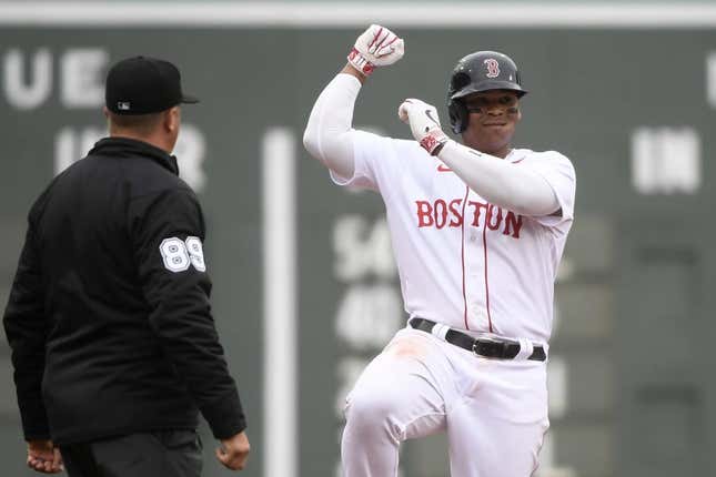 Apr 17, 2023; Boston, Massachusetts, USA;  Boston Red Sox third baseman Rafael Devers (11) reacts after hitting a double against the Los Angeles Angels during the fourth inning at Fenway Park.