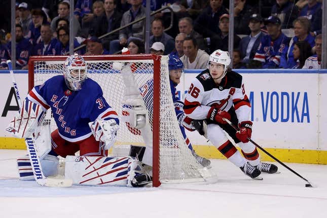Apr 24, 2023; New York, New York, USA; New Jersey Devils center Jack Hughes (86) controls the puck against New York Rangers goaltender Igor Shesterkin (31) and defenseman Adam Fox (23) during the second period in game four of the first round of the 2023 Stanley Cup Playoffs at Madison Square Garden.
