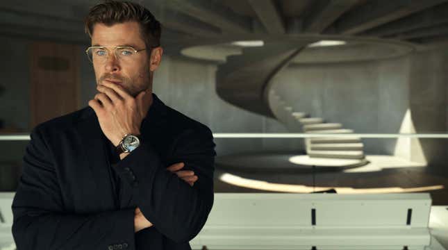 A pensive chris hemsworth with short hair