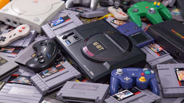 A pile of vintage video games and systmes, including a Sega Genesis, a Game Cube controller, and Super Nintendo games