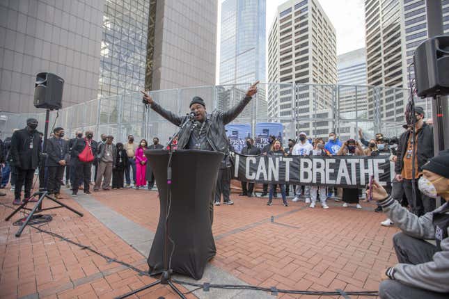 MINNEAPOLIS, MINNESOTA, USA - MARCH 7: A preacher speaks to the crowd during a silent march in memory of George Floyd a day before jury selection for the trial of former Minneapolis police offices Derek Chauvin begins in Minneapolis, Minnesota, United States on March 7, 2021. George was killed by former police officer Derek Chauvin in 2020.