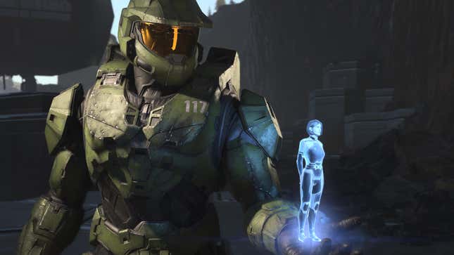 Master Chief holds The Weapon in his hand on the battlefield in Halo Infinite.