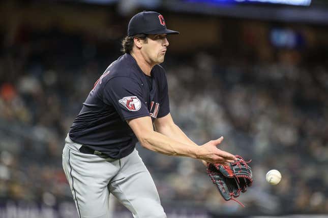 May 1, 2023; Bronx, New York, USA;  Cleveland Guardians starting pitcher Cal Quantrill (47) makes a flip throw to first base for an assist in the seventh inning against the New York Yankees at Yankee Stadium.