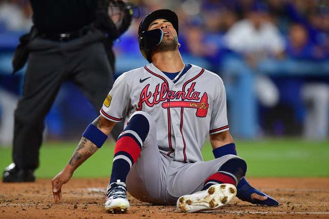 September 1, 2023; Los Angeles, California, USA; Atlanta Braves left fielder Eddie Rosario (8) reacts after caught stealing home against the Los Angeles Dodgers during the second inning at Dodger Stadium.