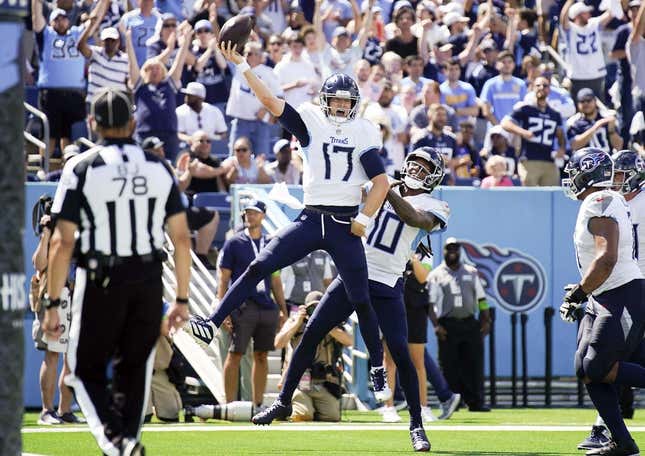 Sep 17, 2023; Nashville, Tennessee, USA; Tennessee Titans quarterback Ryan Tannehill (17) celebrates his touchdown in the third quarter at Nissan Stadium.
