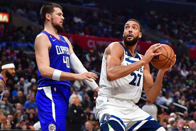Feb 28, 2023; Los Angeles, California, USA; Minnesota Timberwolves center Rudy Gobert (27) moves to the basket against Los Angeles Clippers center Ivica Zubac (40) during the second half at Crypto.com Arena.