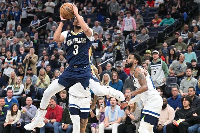 Apr 9, 2023; Minneapolis, Minnesota, USA; New Orleans Pelicans guard CJ McCollum (3) shoots the ball as Minnesota Timberwolves guard Mike Conley (10) looks on during the third quarter at Target Center.
