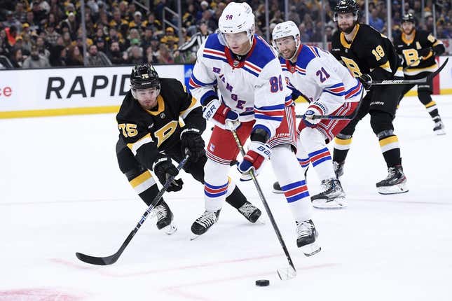 Mar 4, 2023; Boston, Massachusetts, USA; New York Rangers right wing Patrick Kane (88) controls the puck ahead of Boston Bruins defenseman Connor Clifton (75) during the second period at TD Garden.