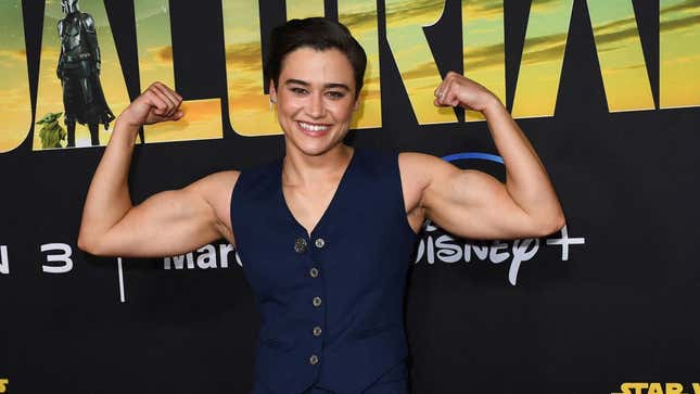 Actress Katy O'Brian flexes her muscles on the red carpet for Season 3 of The Mandalorian