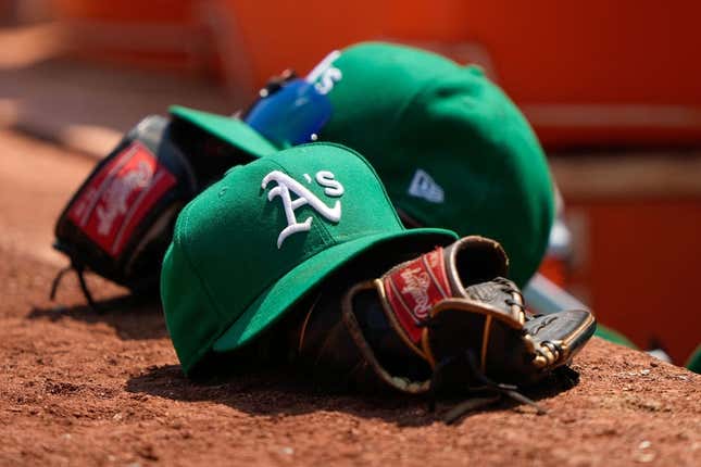 Aug 8, 2021; Oakland, California, USA;  General view of the Oakland Athletics hat and glove during the fifth inning against the Texas Rangers at RingCentral Coliseum.