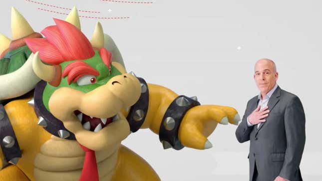 Nintendo of America president Doug Bowser points to himself in front of the King of the Koopas.