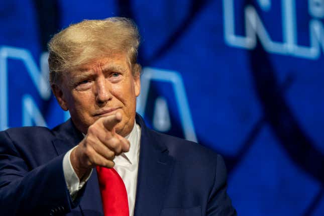 Former U.S. President Donald Trump points to the crowd on arrival at the National Rifle Association (NRA) annual convention at the George R. Brown Convention Center on May 27, 2022 in Houston, Texas