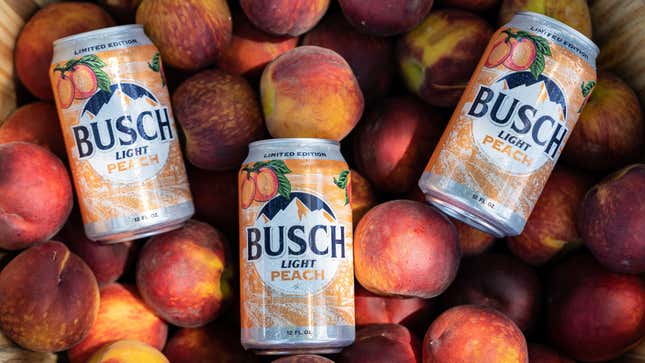 Busch Light Peach cans atop pile of fresh peaches