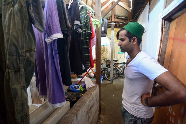 Nauman Rashad outside his shack.