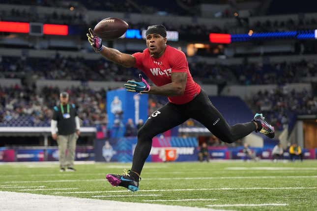 Mar 4, 2023; Indianapolis, IN, USA; Liberty wide receiver Demario Douglas (WO13) catches the ball during the NFL Scouting Combine at Lucas Oil Stadium.