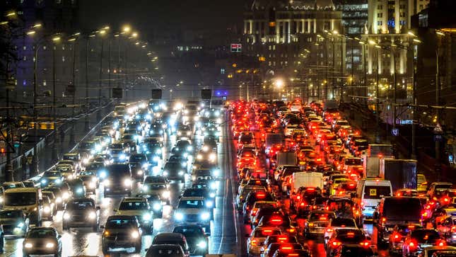 Cars slowly move along a bridge in traffic jam in central Moscow on December 11, 2018.