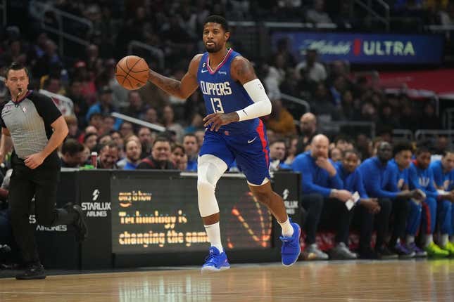 Mar 21, 2023; Los Angeles, California, USA; LA Clippers forward Paul George (13) dribbles the ball against the Oklahoma City Thunder in the first half at Crypto.com Arena.