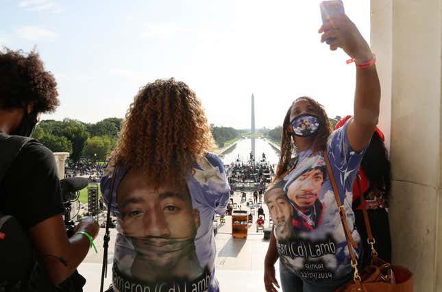 In this Aug. 28, 2020 file photo, Laurie Bey, right, whose son Cameron Lamb was shot and killed by Kansas City police in 2019, stands with Merlon Ragland, Cameron’s aunt, as demonstrators gather at the Lincoln Memorial as final preparations are made for the March on Washington in Washington.