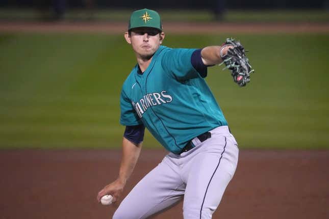 Mar 17, 2023; Peoria, Arizona, USA; Seattle Mariners starting pitcher Chris Flexen (77) pitches against the San Diego Padres during the first inning at Peoria Sports Complex.