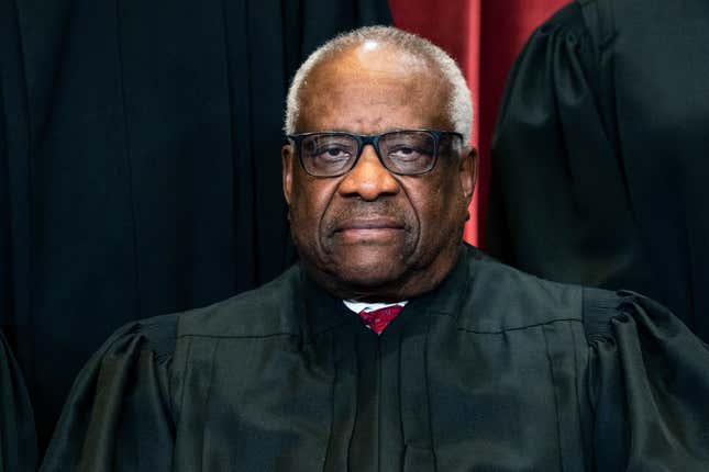Associate Justice Clarence Thomas sits during a group photo at the Supreme Court in Washington, Friday, April 23, 2021. On Monday, Feb. 7, 2022, Georgia’s state Senate voted to erect a monument to U.S. Supreme Court Justice and Georgia native Thomas. 