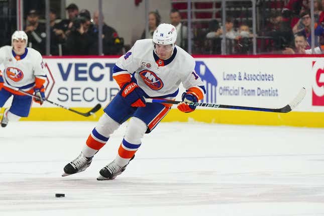 Apr 2, 2023; Raleigh, North Carolina, USA;  New York Islanders center Bo Horvat (14) skates with the puck against the Carolina Hurricanes during the second period at PNC Arena.