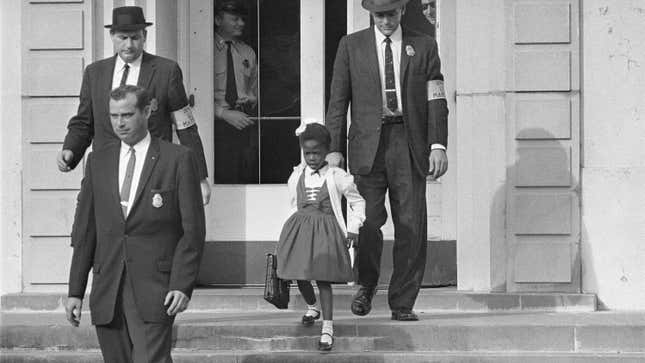 U.S. Deputy Marshals escort 6-year-old Ruby Bridges from William Frantz Elementary School in New Orleans, in this November 1960, file photo.