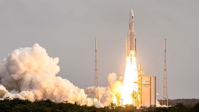 A photo of a rocket launching from a pad. 