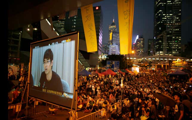 Protesters watch the talk at the Admiralty camp.
