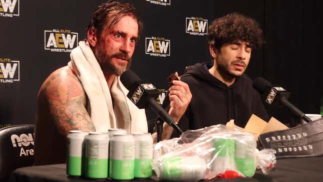 CM Punk (left, with pastry) and Tony Khan