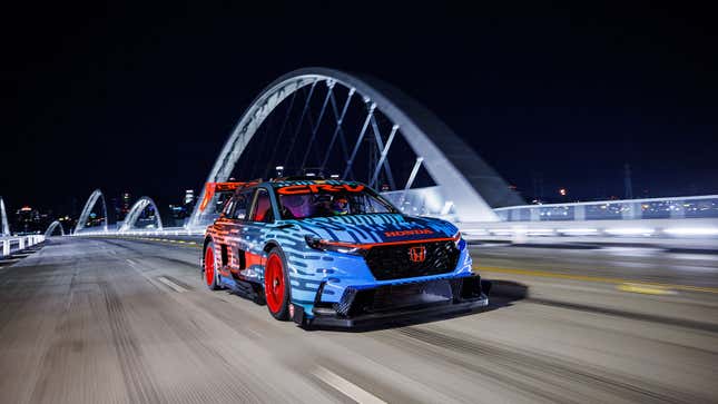 A photo of the Honda CR-V racer driving over a bridge. 