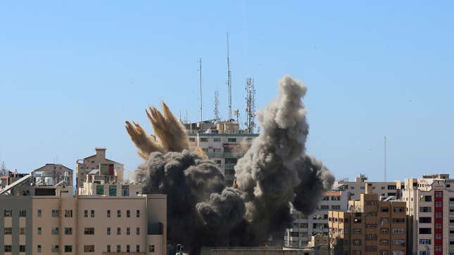 A tower housing AP, Al Jazeera offices collapses after Israeli missile strikes in Gaza city