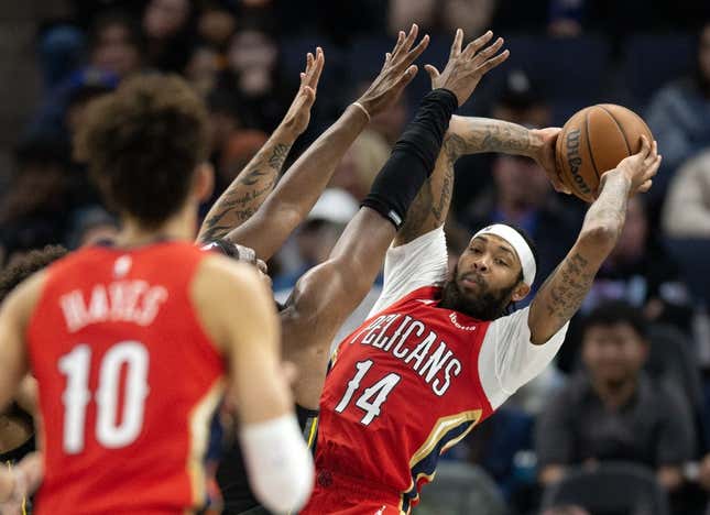 Mar 3, 2023; San Francisco, California, USA; New Orleans Pelicans forward Brandon Ingram (14) looks for a teammate to pass to as he is pressured by Golden State Warriors forward Kevon Looney during the third quarter at Chase Center.