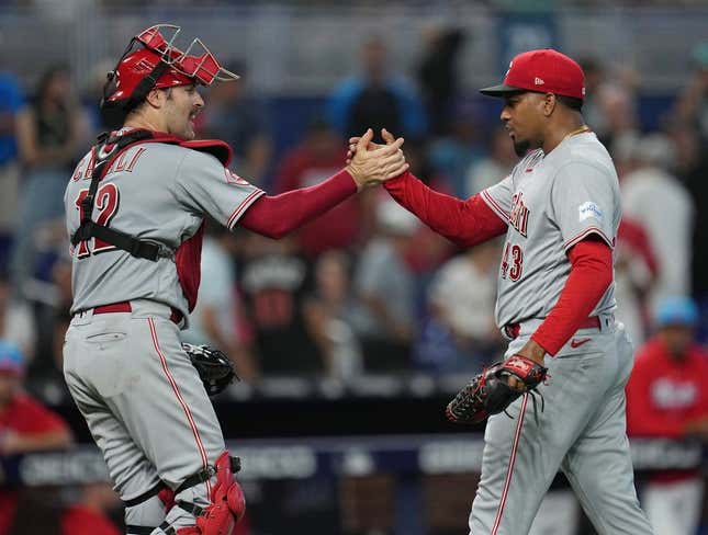 May 13, 2023; Miami, Florida, USA; Cincinnati Reds relief pitcher Alexis Diaz (43) and catcher Curt Casali (12) celebrate a victory over the Miami Marlins at loanDepot Park.