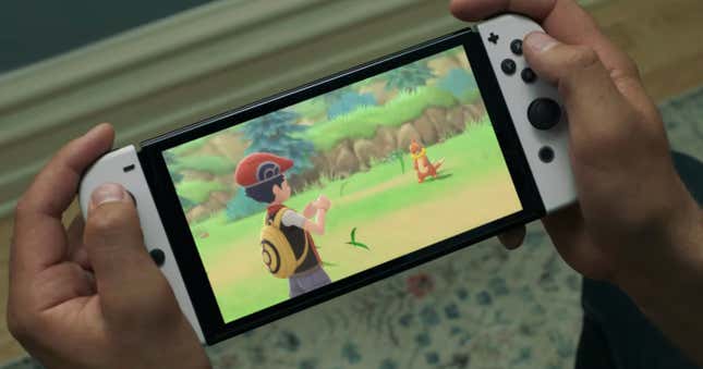 The new Nintendo Switch OLED model, playing a Pokémon game. 