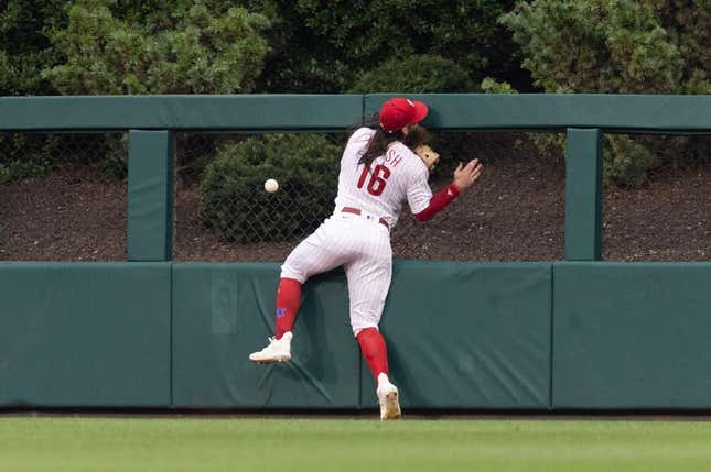 Aug 5, 2023; Philadelphia, Pennsylvania, USA; Philadelphia Phillies center fielder Brandon Marsh (16) is injured while attempting to catch the triple of Kansas City Royals second baseman Samad Taylor (not pictured) during the fifth inning at Citizens Bank Park.