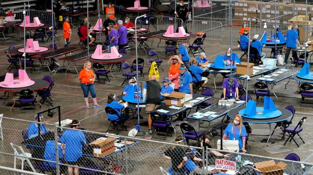Contractors working for Florida-based Cyber Ninjas during a supposed audit of votes in Maricopa County, Arizona, at Veterans Memorial Coliseum in Phoenix in May 2021.