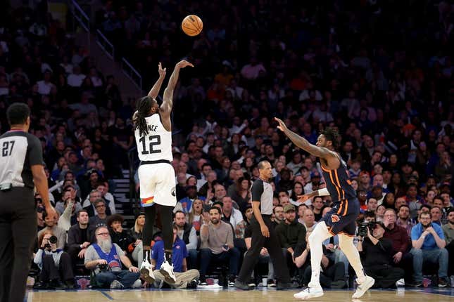 Mar 20, 2023; New York, New York, USA; Minnesota Timberwolves forward Taurean Prince (12) shoots a three point shot over New York Knicks forward Julius Randle (30) during the fourth quarter at Madison Square Garden.