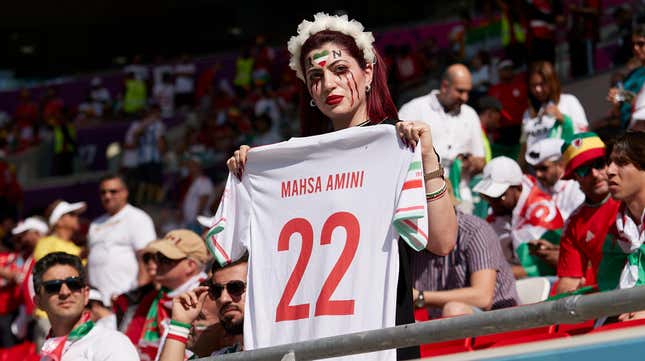  A fan of the Iran team pays tribute to Mahsa Amini and protests for women’s freedom ahead of the FIFA World Cup 2022 Group B match between Wales and Iran on November 25, 2022, in Doha, Qatar.