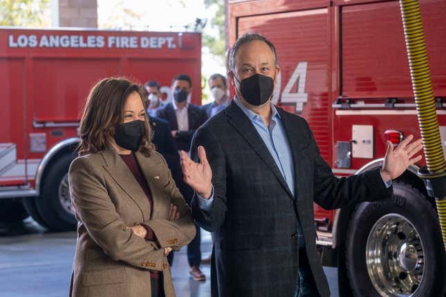Second gentleman Douglas Emhoff, right, wearing a face mask accompanied by Vice President Kamala Harris speaks with firefighters while visiting the Los Angeles Fire Department Station 94, in Los Angeles, Friday, Dec. 24, 2021. 


